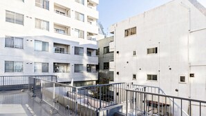 A multi-story residential building with balconies and a rooftop terrace. - Ikebukuro Yamase Building GR1 (Tokyo)