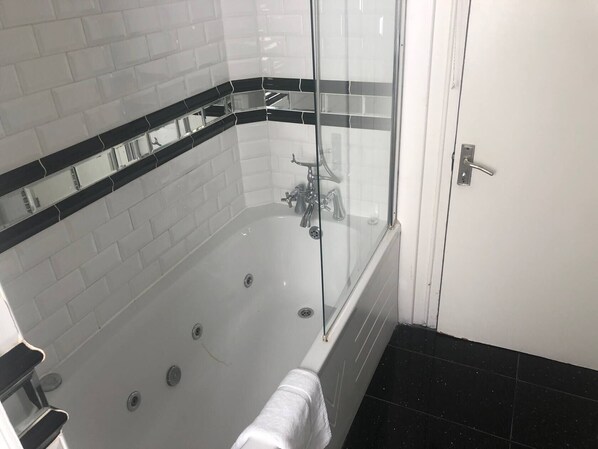 Combined shower/tub, hair dryer, towels, soap