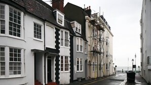 A narrow street lined with traditional buildings, some under construction with scaffolding. - NO LONGER AVAILABLE FOR RENTAL (Kemptown)