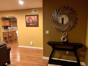 Relax in this stylish living space with a fully equipped kitchen and comfortable seating area.