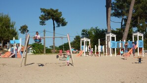 A playground with swings, slides, and climbing structures.