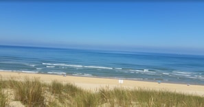 A beach with clear skies and calm waters.