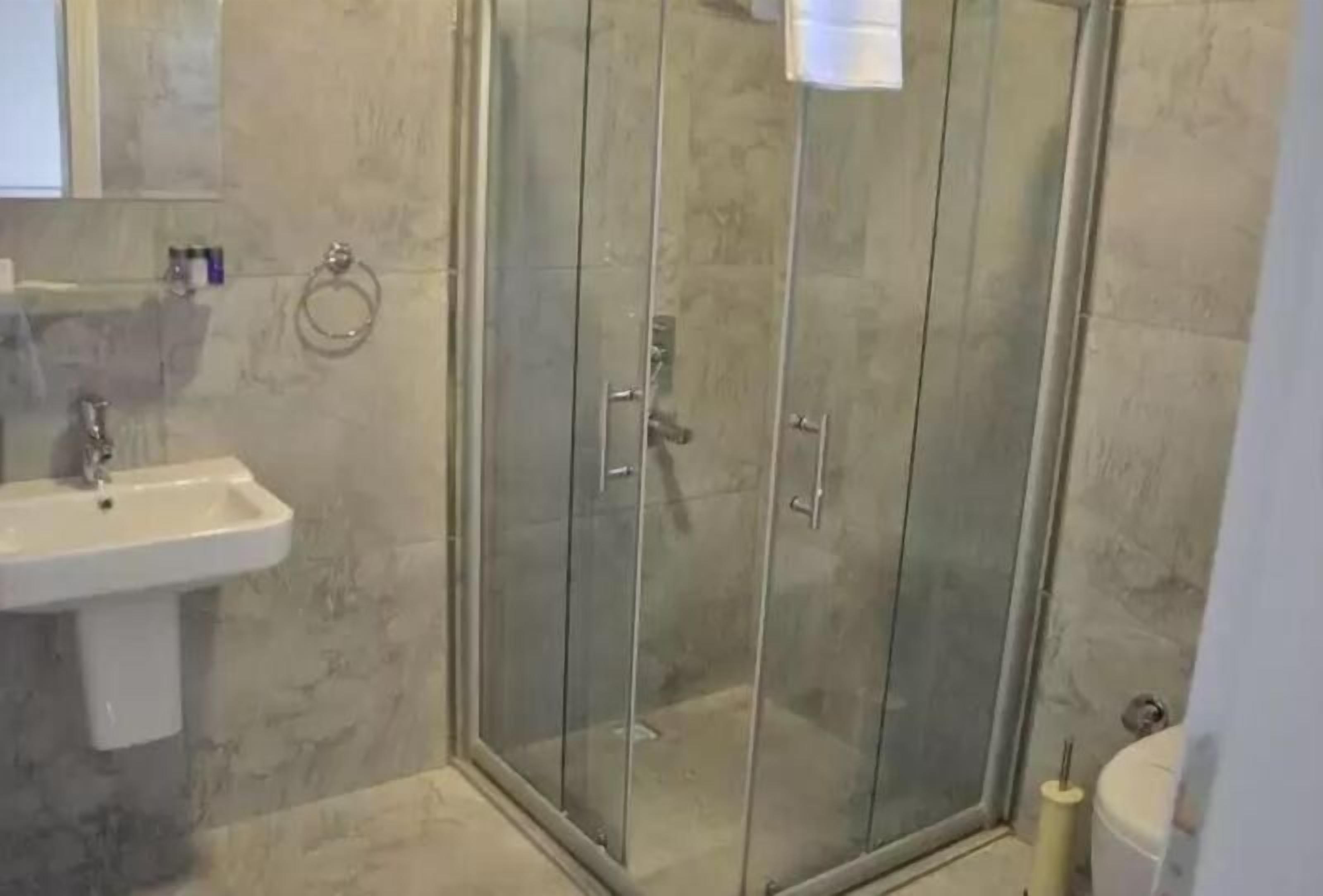 shower, rainfall showerhead, hair dryer, slippers