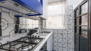 Fridge, stovetop, coffee/tea maker, cookware/dishes/utensils