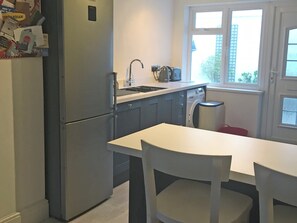 Oven, dishwasher, high chair, cookware/dishes/utensils