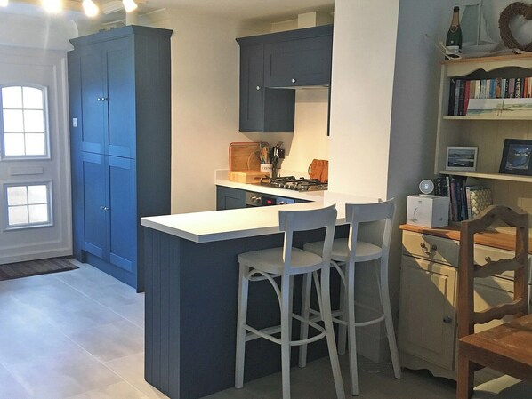 Oven, dishwasher, high chair, cookware/dishes/utensils