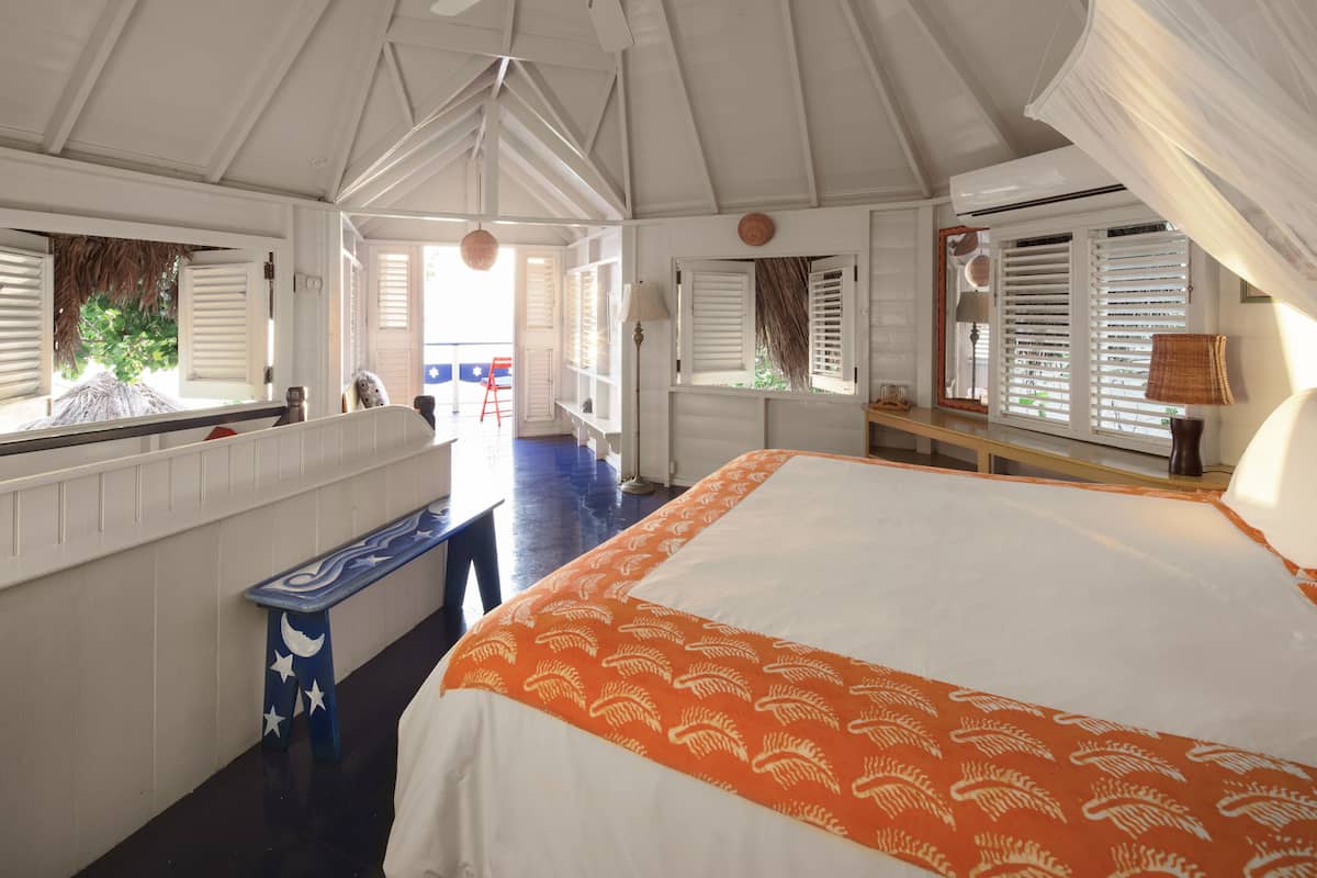 deluxe room, 1 king bed (two bedroom ocean view cottage) | 1 bedroom, free minibar, in-room safe, individually decorated