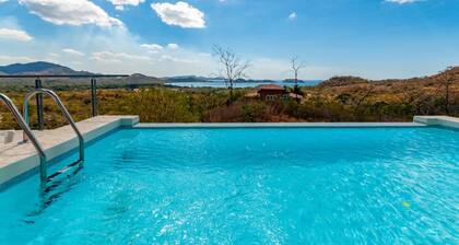 Modern Hillside Home with Sleek Interiors and Panoramic Poolside Views