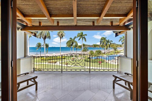 Luxury Beachfront Condo w/ High-End Wood Furnishings and Ocean Views in Exclusive Community