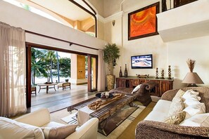 Villa, 5 Bedrooms, Accessible, Beach View | Living room | TV - Luxurious Beachfront Mansion with a Stunning Infinity Pool in Playa Flamingo (Cabo Velas)