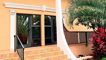 Stylish two-story residence with a charming garden and an entrance.
