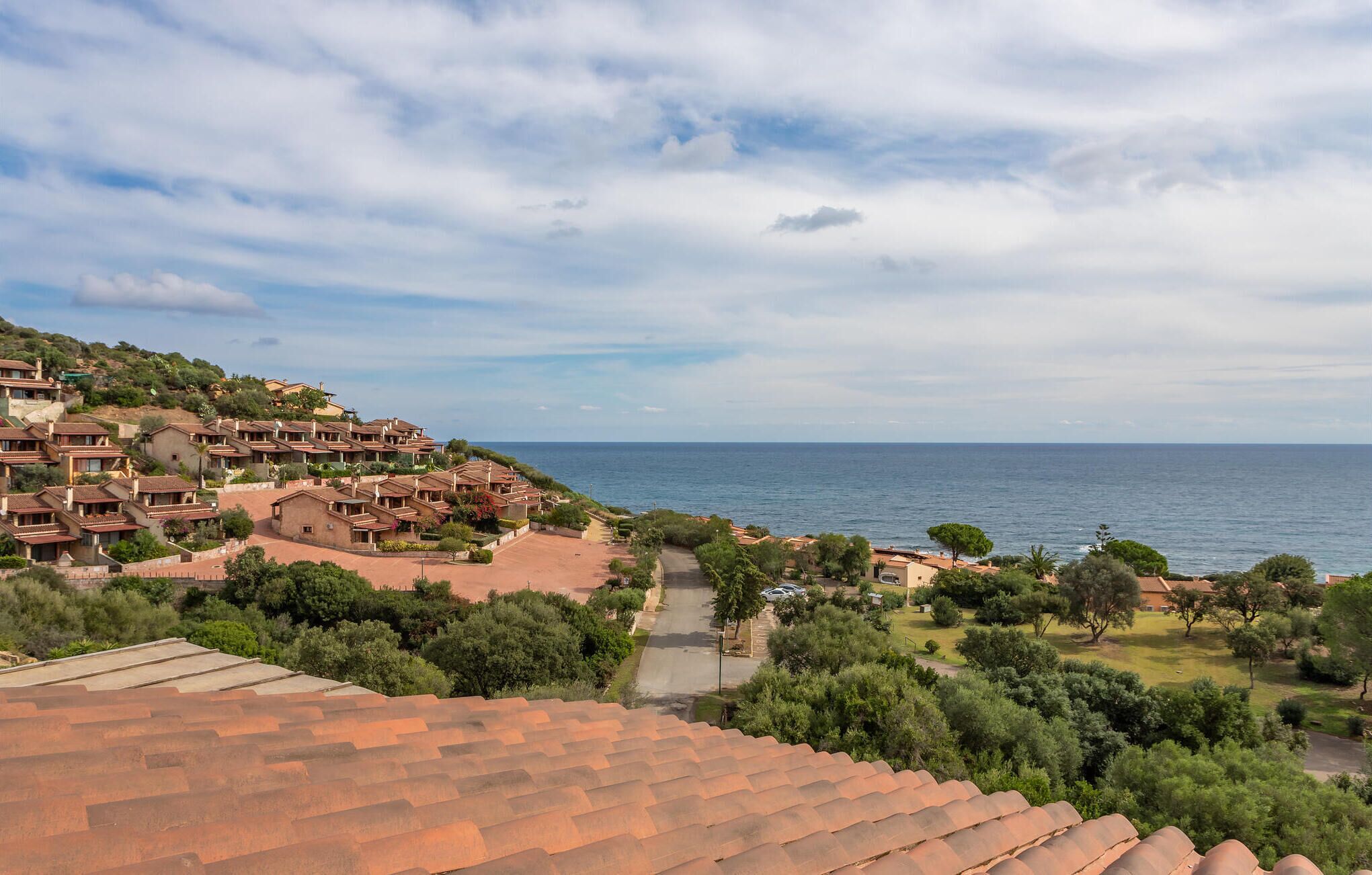 A coastal residential area with terraced houses overlooking the sea.