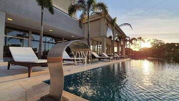 Relax by the pool surrounded by lounge chairs and take in the view.