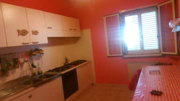 Fridge, oven, stovetop, dining tables