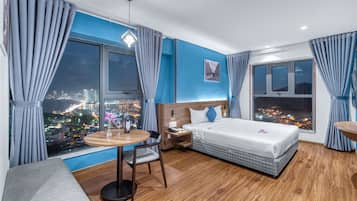 Deluxe Room, Sea View | Minibar, in-room safe, desk, free WiFi