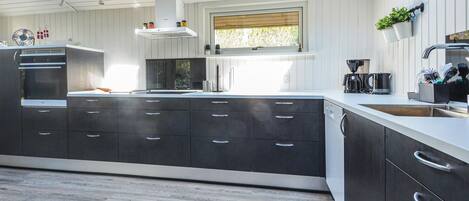 Fridge, stovetop, dishwasher, coffee/tea maker