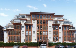 A multi-story residential building with balconies, large windows, and a central entrance. - Gorgeous apartment in Torrevieja (Torrevieja)