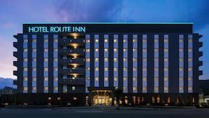 A multi-story hotel with a prominent sign reading "HOTEL ROUTE INN". - Hotel Route Inn Shinano Omachi Ekimae (Omachi)