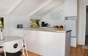 Fridge, stovetop, dishwasher, coffee/tea maker