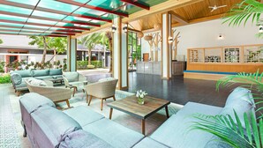 A spacious lobby with a wooden ceiling, a reception desk, and comfortable seating areas. - Lady Naya Villas (Rawai)