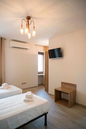 Desk, laptop workspace, free WiFi, bed sheets