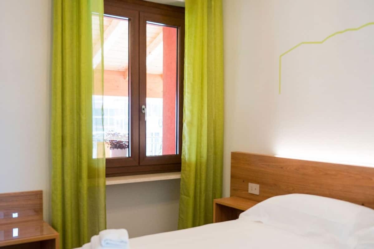 Desk, laptop workspace, free WiFi, bed sheets
