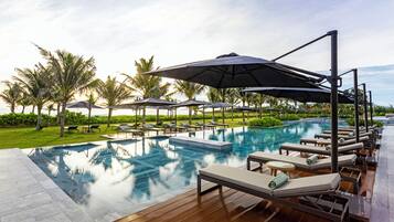 Outdoor pool, open 6:00 AM to 10:00 PM, sun loungers