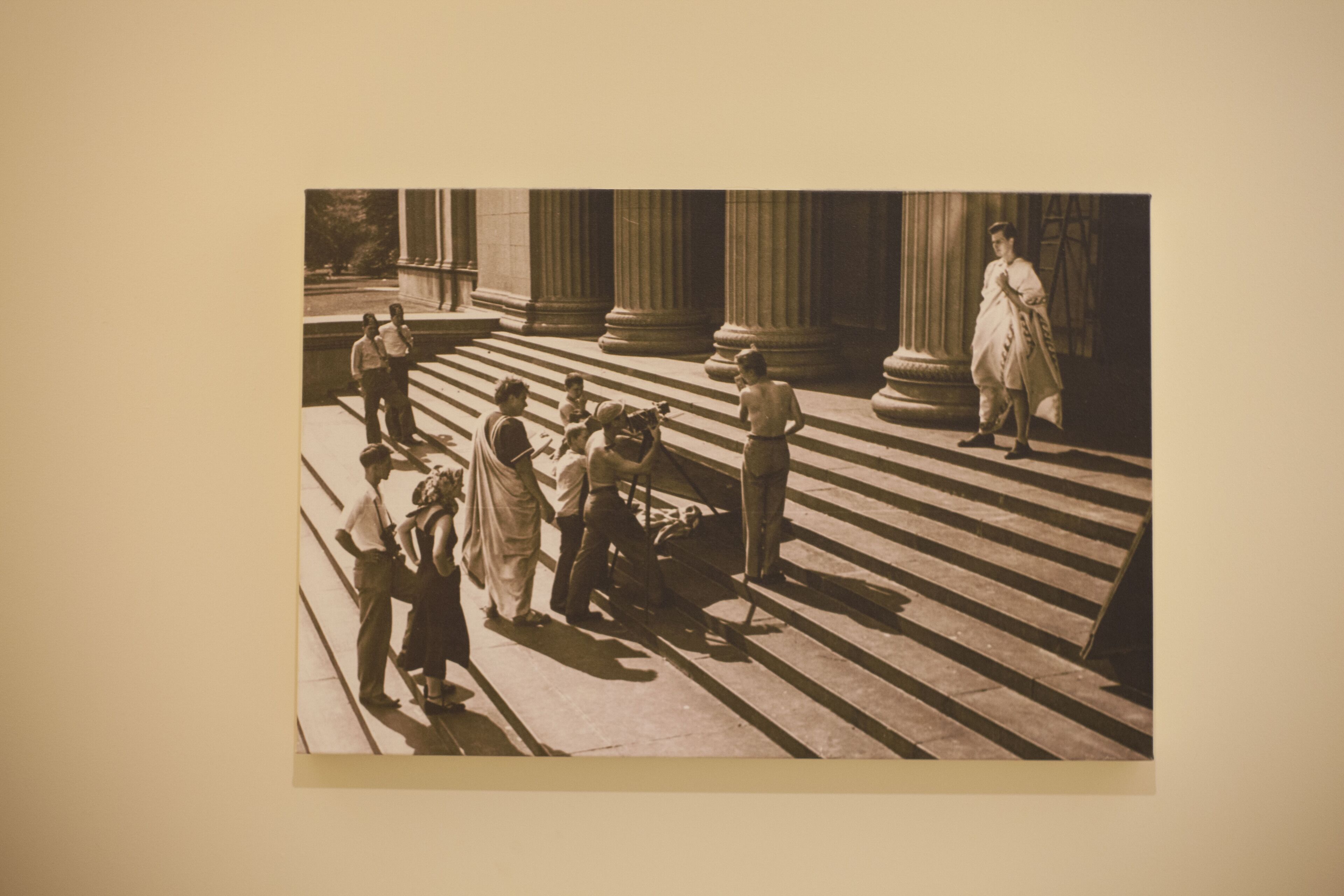 A vintage photograph of a building with columns and steps.