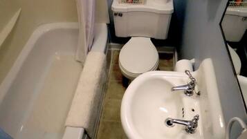 Combined shower/bathtub, hair dryer, towels, soap
