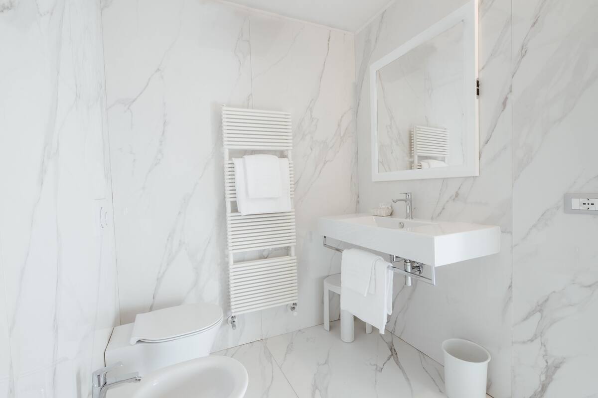 shower, hair dryer, slippers, bidet