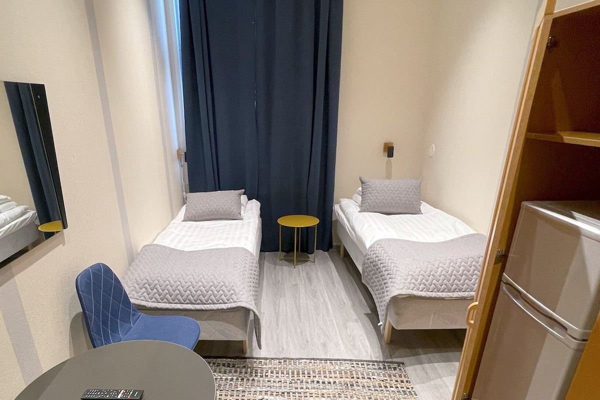 Economy Twin Room, 2 Single Beds, Non Smoking, Shared Bathroom | 1 bedroom, iron/ironing board, free WiFi, bed sheets