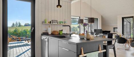 Fridge, stovetop, dishwasher, coffee/tea maker