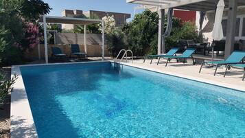 Outdoor pool, a heated pool, pool umbrellas, sun loungers