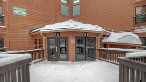 A wooden building with two entrances labeled AA and BB, surrounded by snow. - Bb103 Buffalo Ge 2br 2ba 2 Bedroom Condo by RedAwning (Silverthorne)