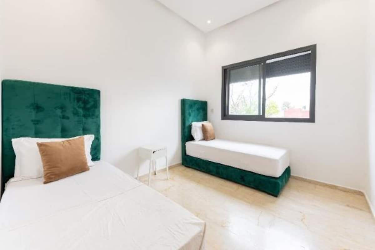 2 bedrooms, premium bedding, laptop workspace, blackout curtains
