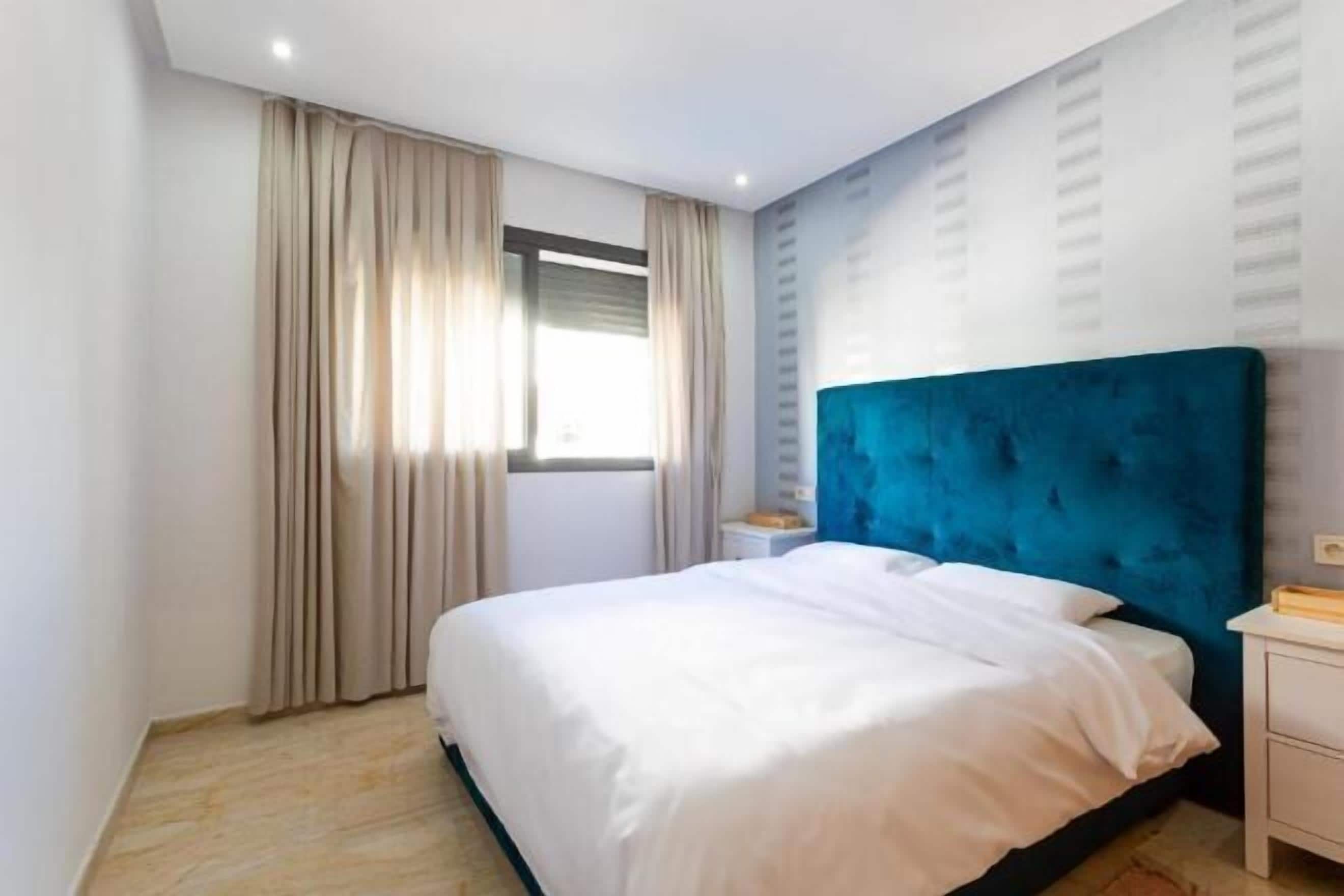 2 bedrooms, premium bedding, laptop workspace, blackout drapes