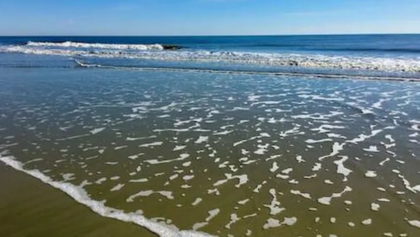 A beach with waves approaching the shore. - Beautiful East Beach Cottage with Pool (St. Simons)