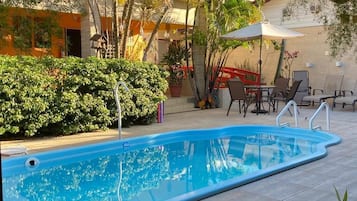 Outdoor pool, pool umbrellas, pool loungers