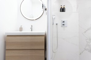 Shower, free toiletries, hair dryer, slippers