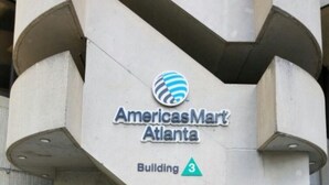 The exterior of the AmericasMart Atlanta building, featuring a modern architectural design with a prominent logo and the building number 3. - Conveniently Located Downtown Apartment (Atlanta)