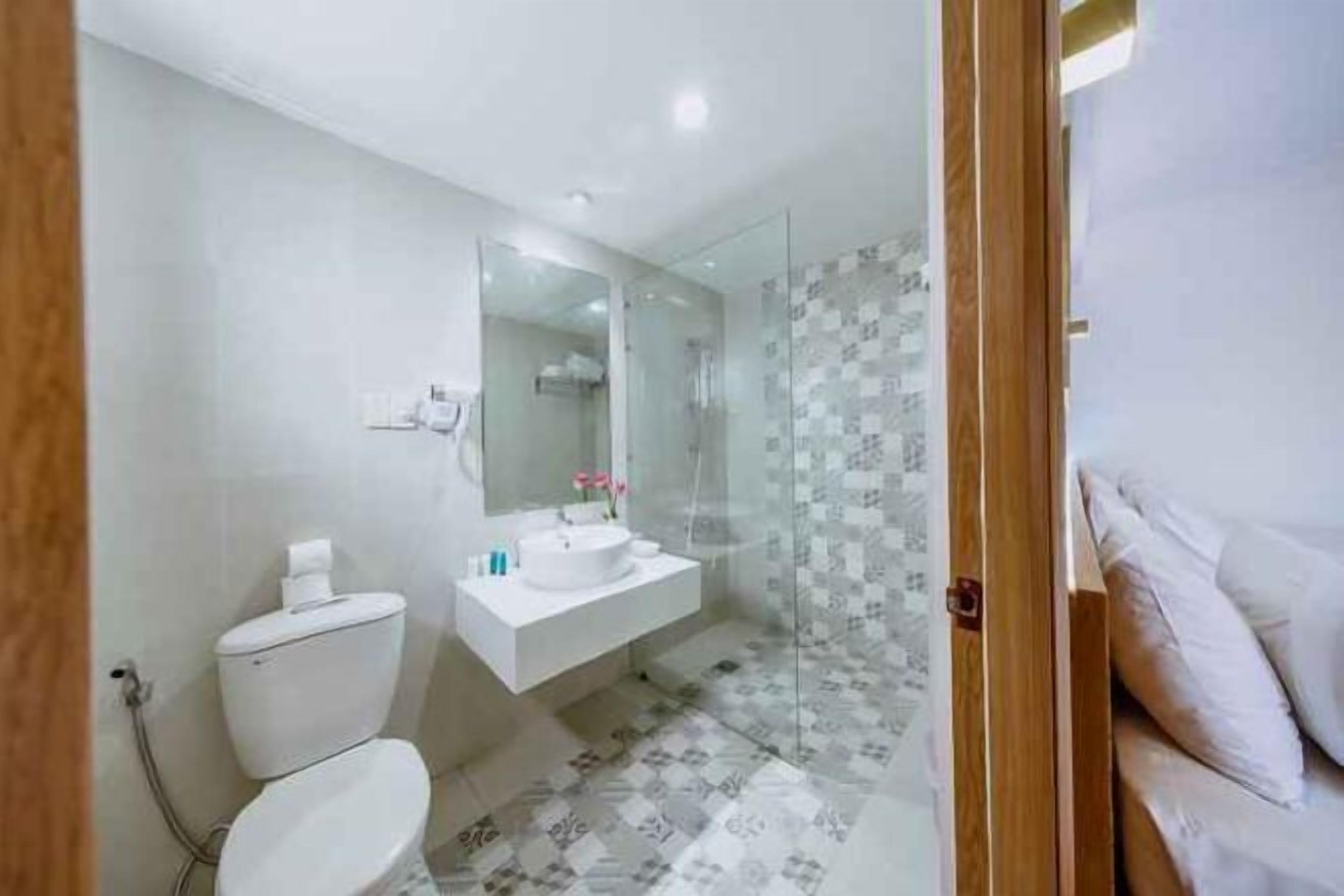 Shower, designer toiletries, hair dryer, bathrobes