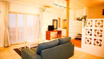 Villa Premium, vue océan | Salle de séjour | Télévision à écran plat