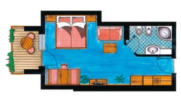 A floor plan of a hotel room with a bed, a desk, a chair, a small table, a sofa, a bathroom with a toilet, sink, and shower.