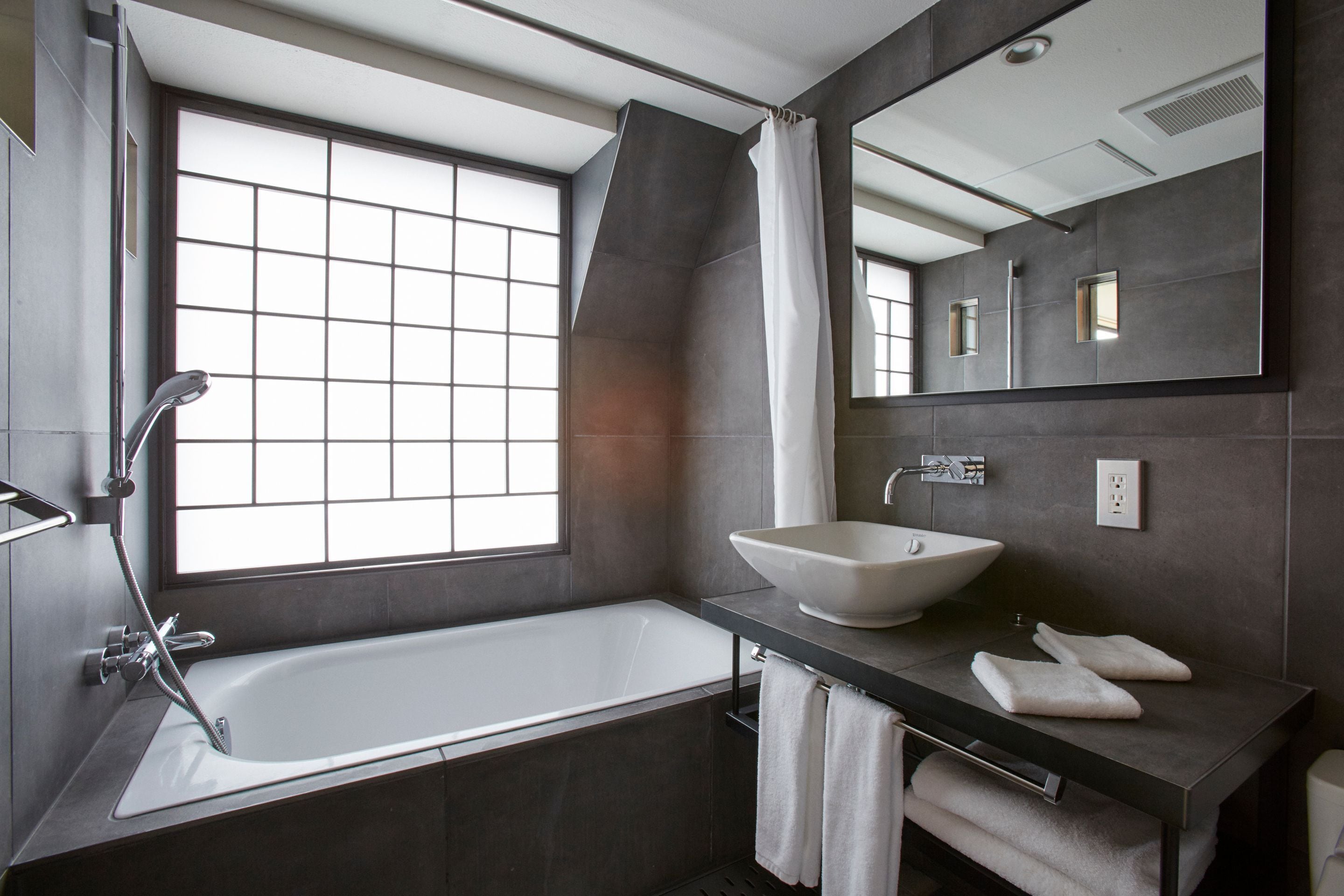 combined shower/bathtub, free toiletries, hair dryer, slippers