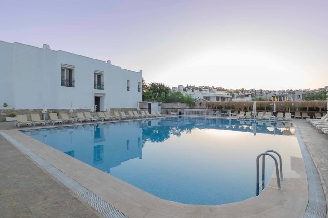 Seasonal outdoor pool, pool umbrellas, pool loungers