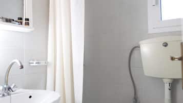 Shower, free toiletries, towels, toilet paper