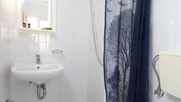 Shower, free toiletries, towels, toilet paper