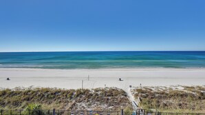 A beach with clear skies and calm waters.