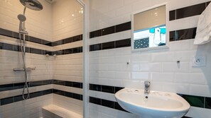 Shower, hair dryer, towels, soap