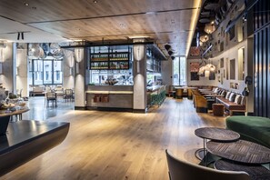 Relax and socialize in this inviting space with a central bar and comfortable seating areas.